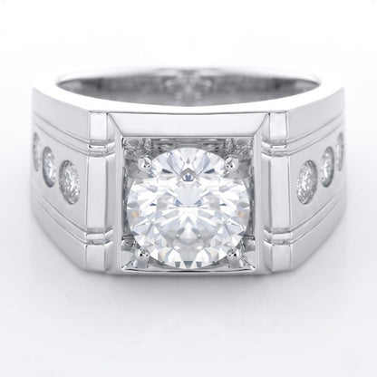 Silver ring with a 2ct round briliant central diamond and smaller diamonds on the sides against a white background