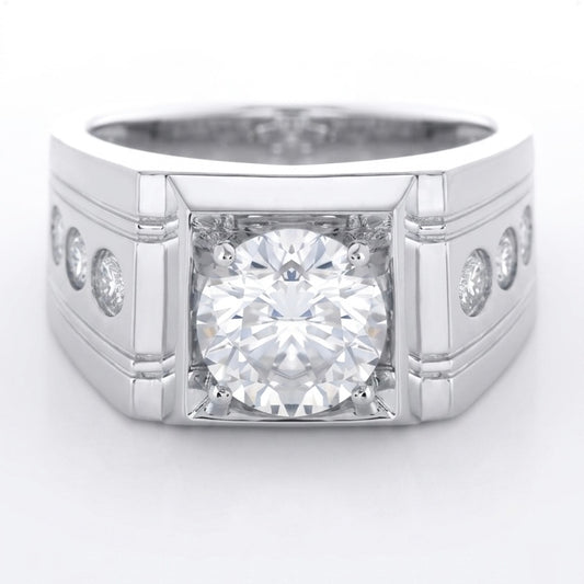 Silver ring with a 2ct round briliant central diamond and smaller diamonds on the sides against a white background