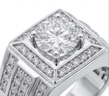 Diamond ring with a prominent central stone and smaller diamonds around on a white background