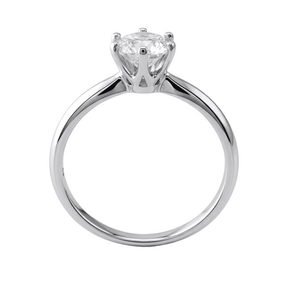 Moissanite ring on a light gray background