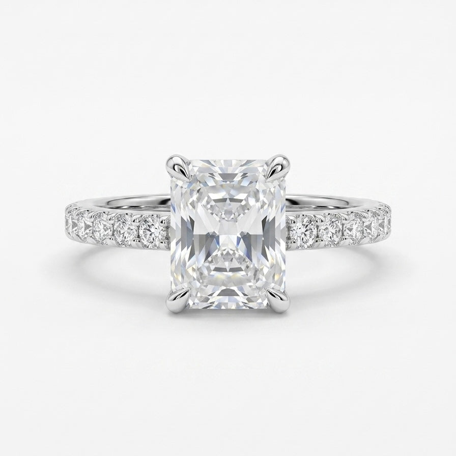 Radiant cut moissanite engagement ring in 925 sterling silver rhodium plated with pave band. Elegant diamond alternative jewelry.
