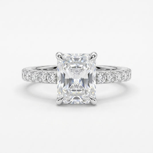 Radiant cut moissanite engagement ring in 925 sterling silver rhodium plated with pave band. Elegant diamond alternative jewelry.
