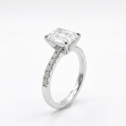 Radiant cut moissanite engagement ring in 925 sterling silver rhodium plated with pave band. Sparkling diamond alternative.
