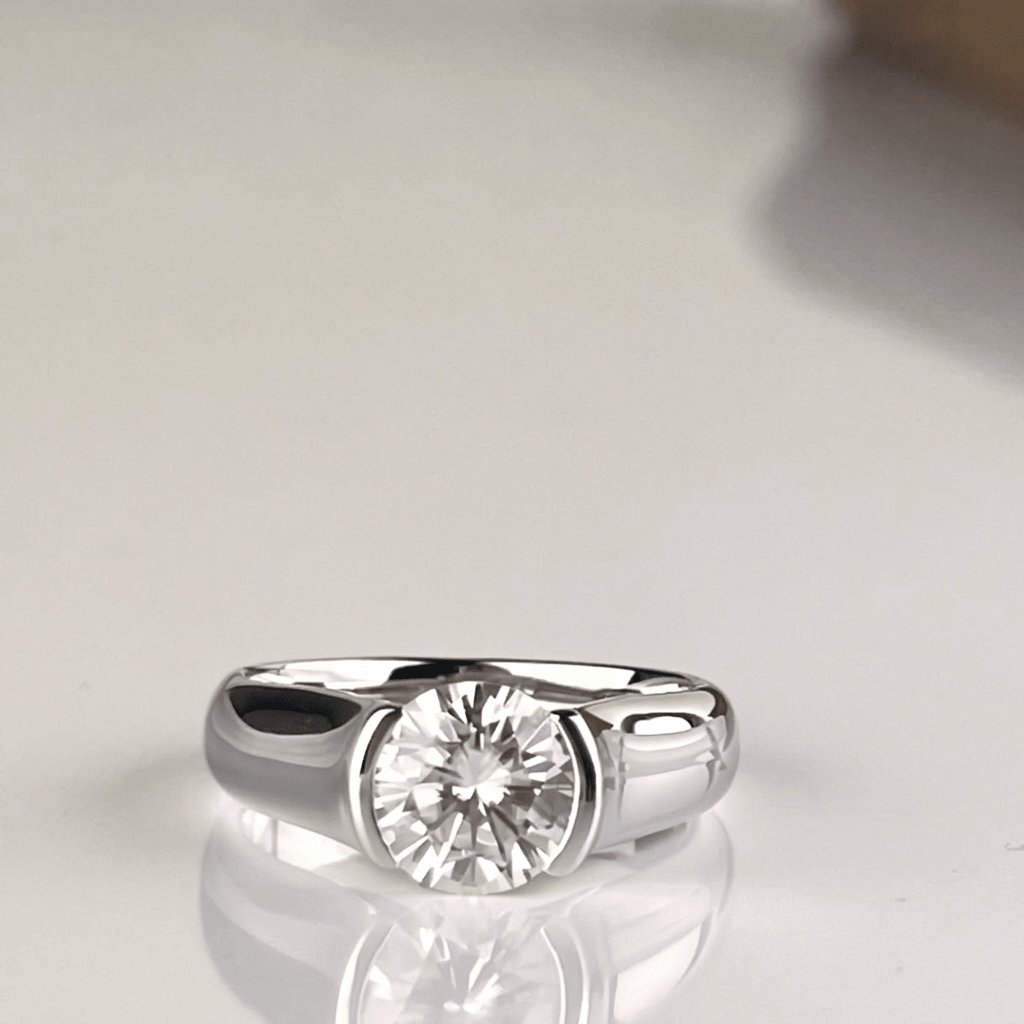 Whisperglow 2ct moissanite ring, sterling silver stackable band, front view on white background.