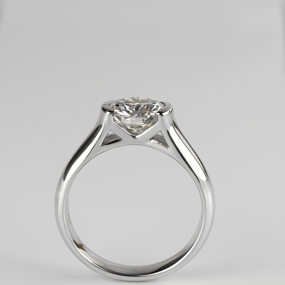 Whisperglow 2ct moissanite ring standing upright, sterling silver stackable band front view.