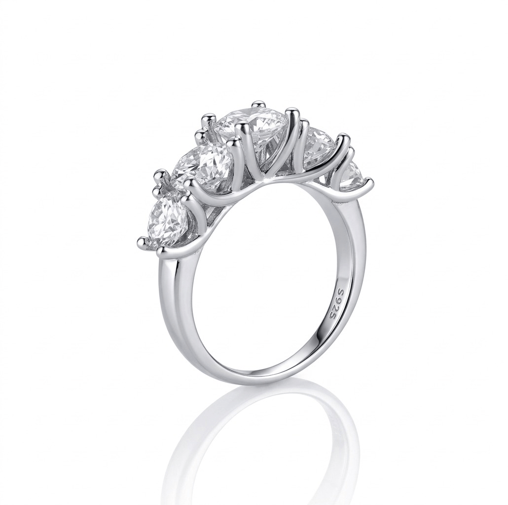 Silver ring with five diamonds on a white background