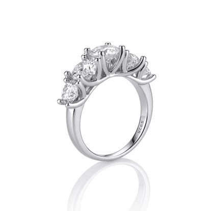 Silver ring with five diamonds on a white background