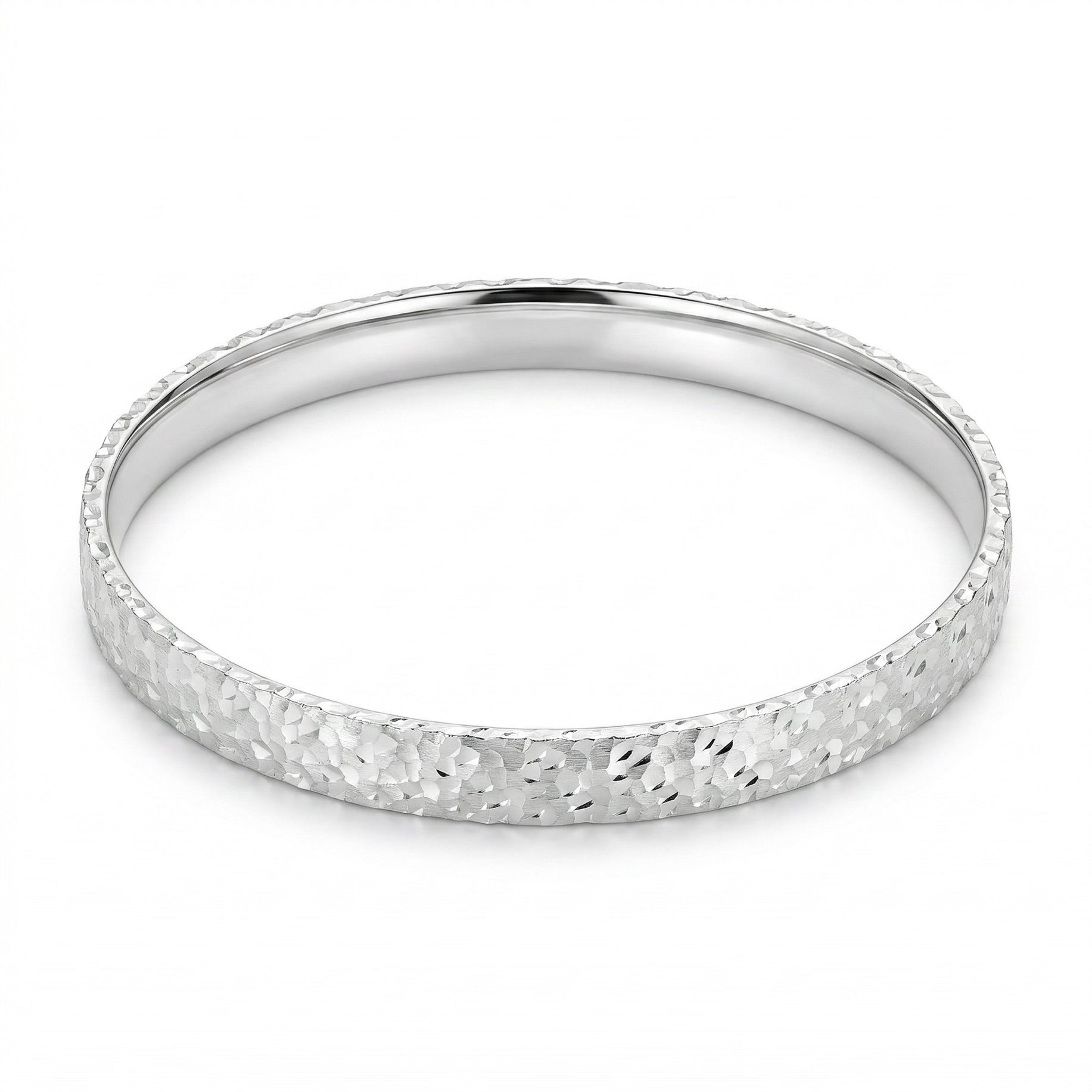 Top-down view of Mermaid Scale sterling silver bangle showcasing the full mermaid scale engraved pattern.