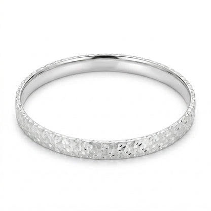 Top-down view of Mermaid Scale sterling silver bangle showcasing the full mermaid scale engraved pattern.